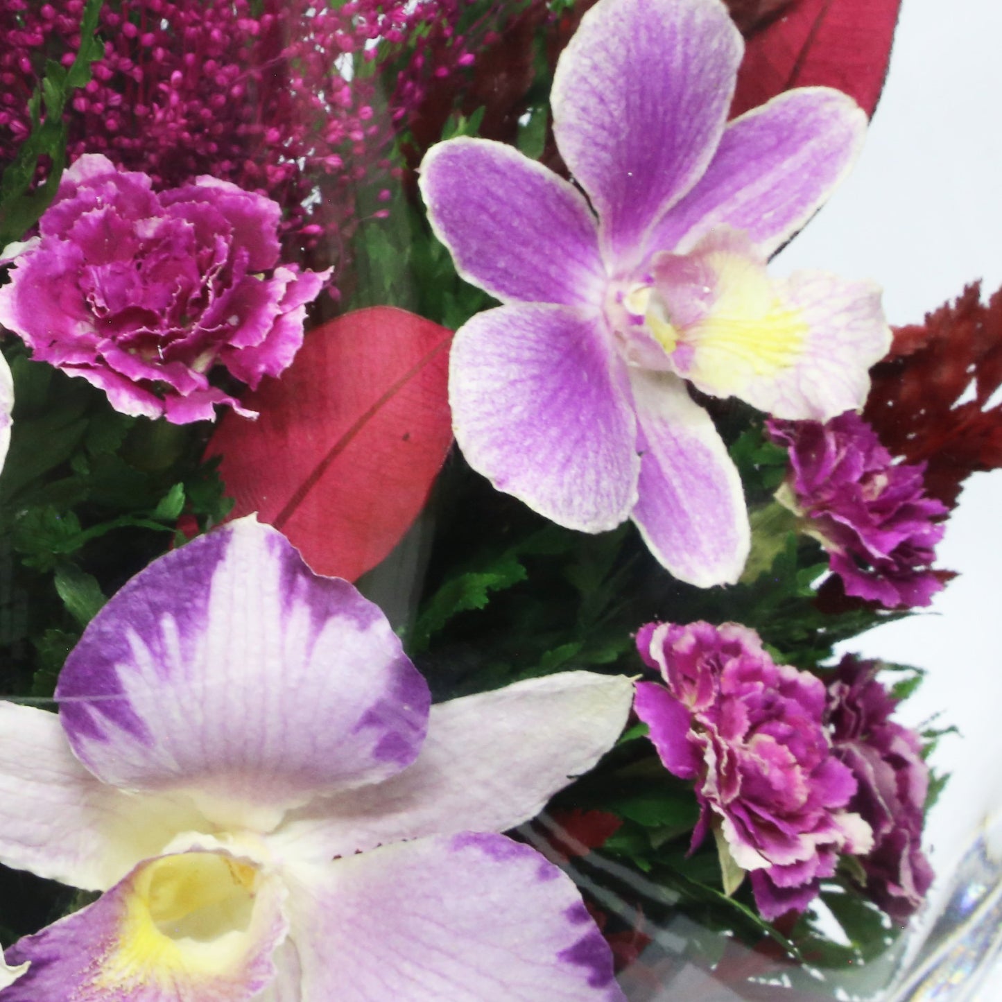 35753 Long-Lasting Purple Orchids, Limoniums with Greenery in a Flat Rugby Glass Vase - FIORA FLOWER