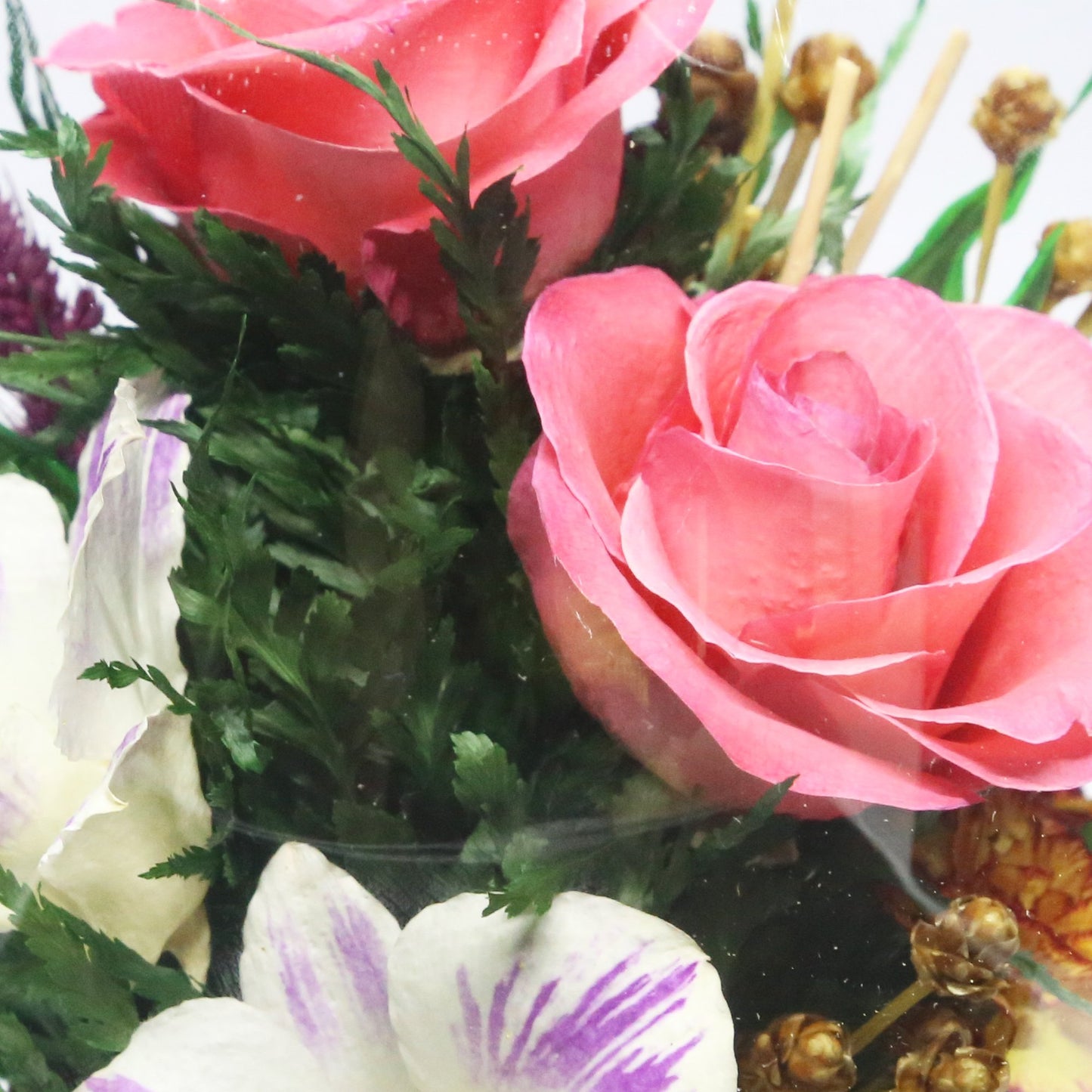 61097 Long-Lasting Pink Roses, Purple-Striped White & King Dragon Orchids, Orange Spray Carnations in an Elliptical Glass Vase - FIORA FLOWER