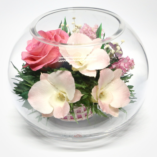31045 Long-Lasting Pink Roses and Orchids with Greenery in a Round Glass Vase